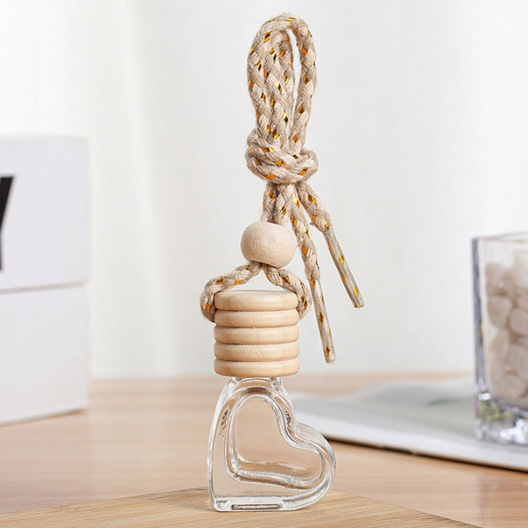 Heart-shaped glass bottle with wooden cap and rope, quality gift on wooden table