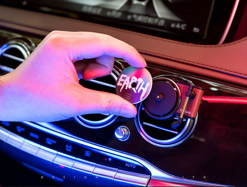 Hand placing EARTH air freshener on luxury car vent, quality gift, sps street style decor