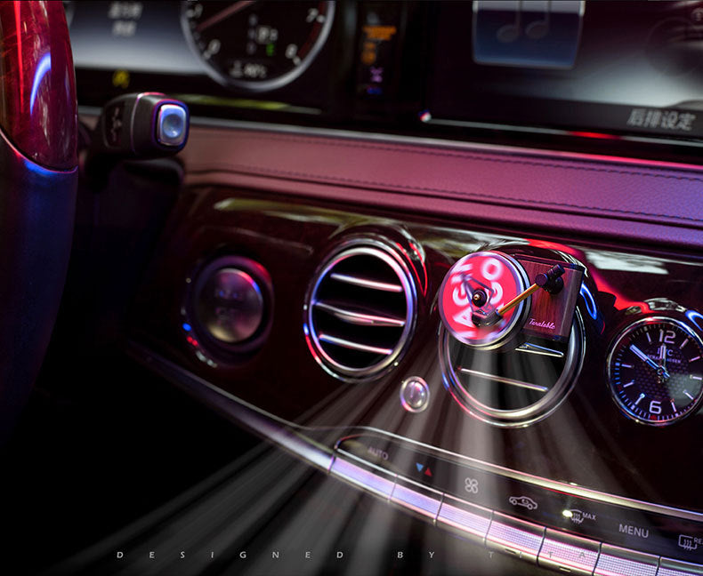 Luxury car dashboard with stylish retro turntable air vent accessory and ambient lighting