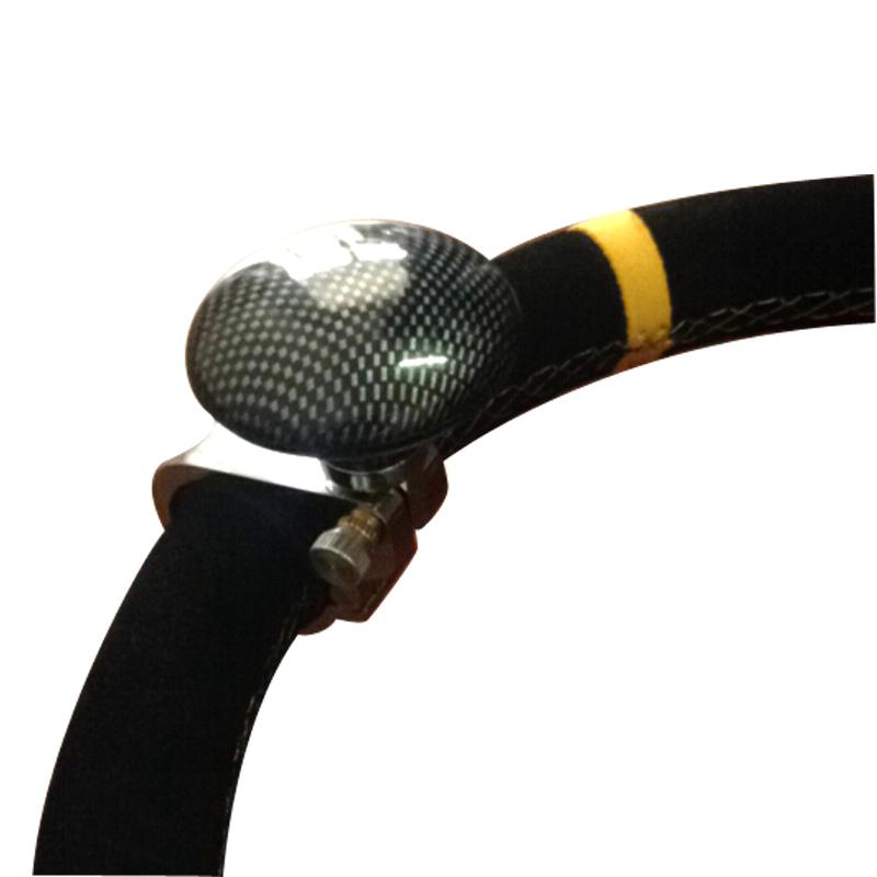 Carbon fiber spinner knob on black steering wheel with yellow accent, sps street style gift