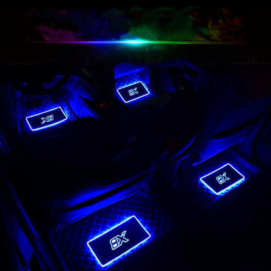 Car interior with blue LED illuminated floor mats, modern street style accessory