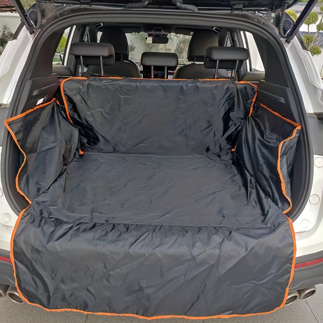 SUV trunk lined with black protective cargo cover, orange trim, sps street style accessory