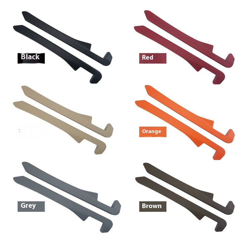 Six pairs of colored plastic shoehorns in black, red, beige, orange, grey, and brown.