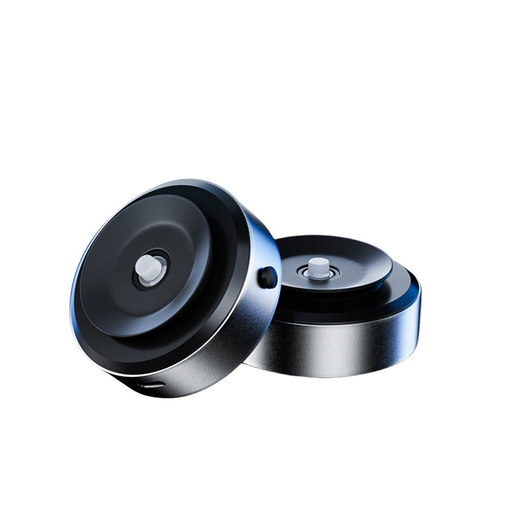 sleek black and silver spinning tops on white background, modern quality gift idea