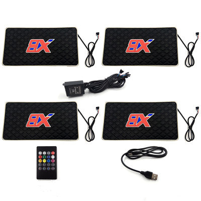 Set of four black electronic pads with red BX logo, remote, and cables for quality gifts item