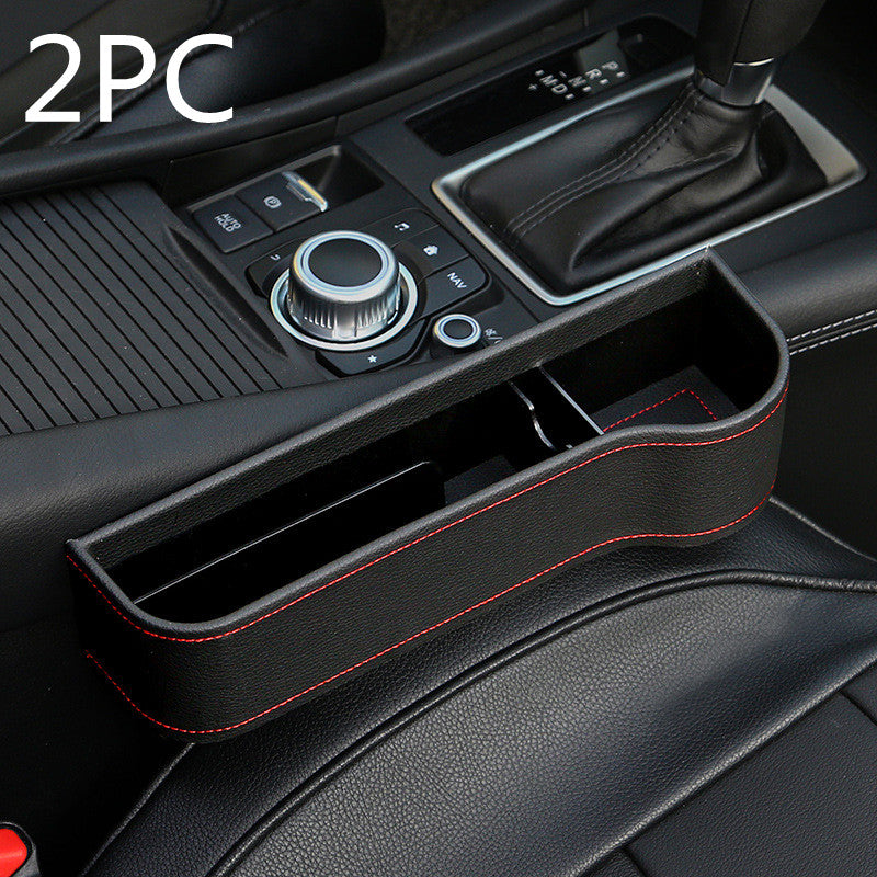 2-piece black leather car seat gap organizer with red stitching in vehicle interior