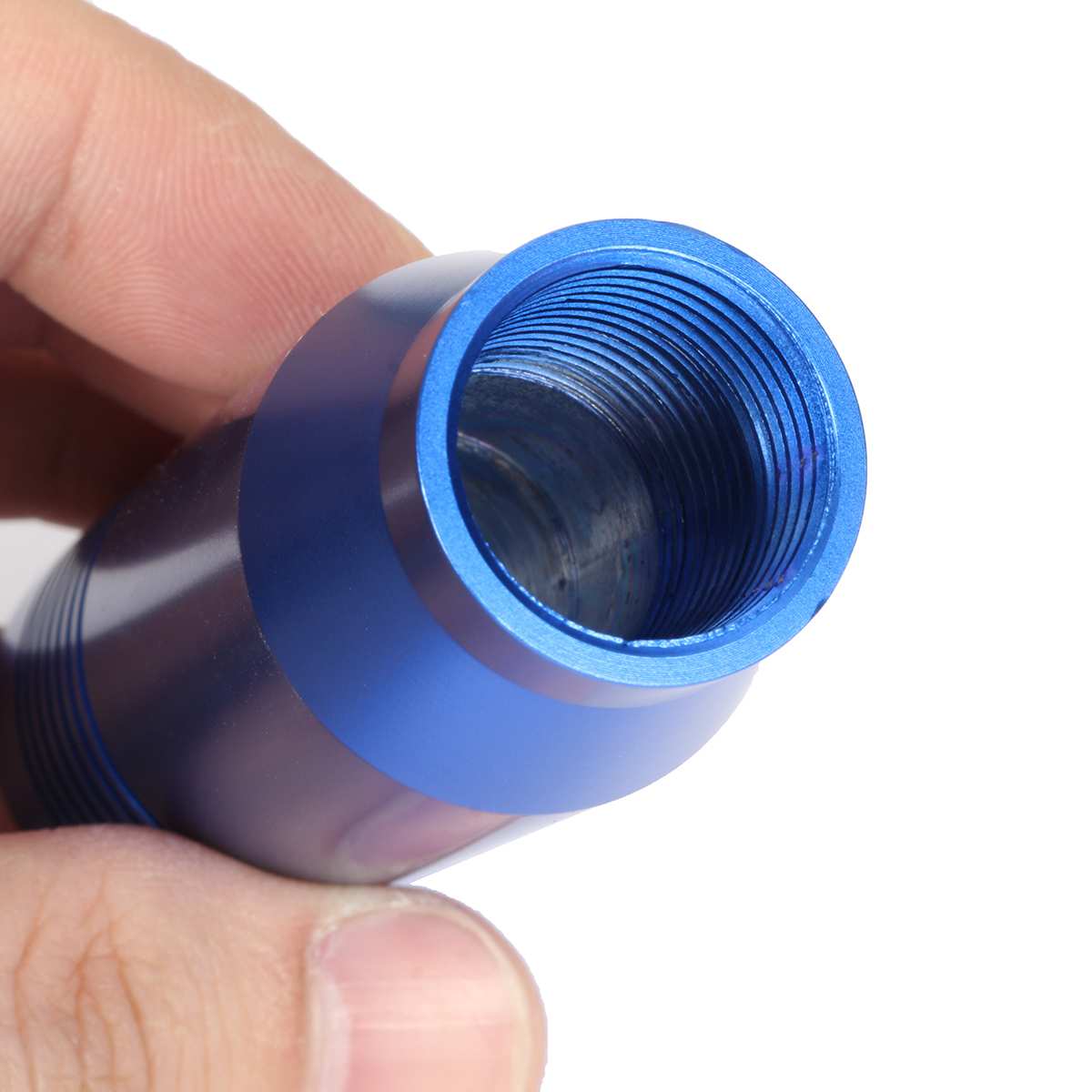 Hand holding blue metal threaded tube, sps street style quality gift item