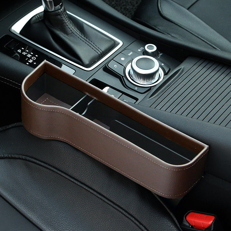 Brown car seat gap organizer in a black leather car interior, sps street style accessory