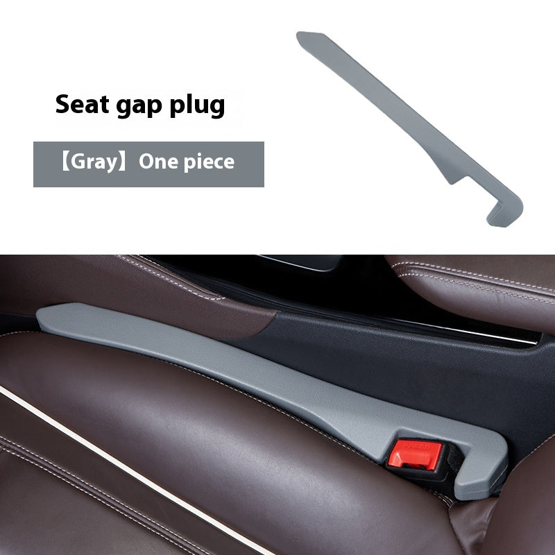 Gray seat gap plug for cars, fitted between brown car seats, quality useful car accessory