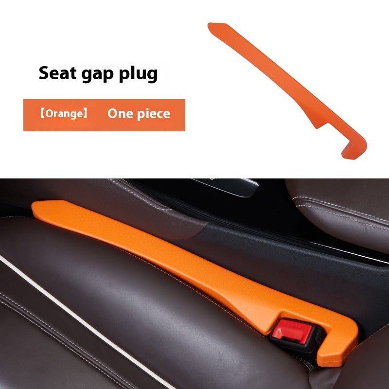 Orange car seat gap plug installed between brown leather seats, sps street style useful item