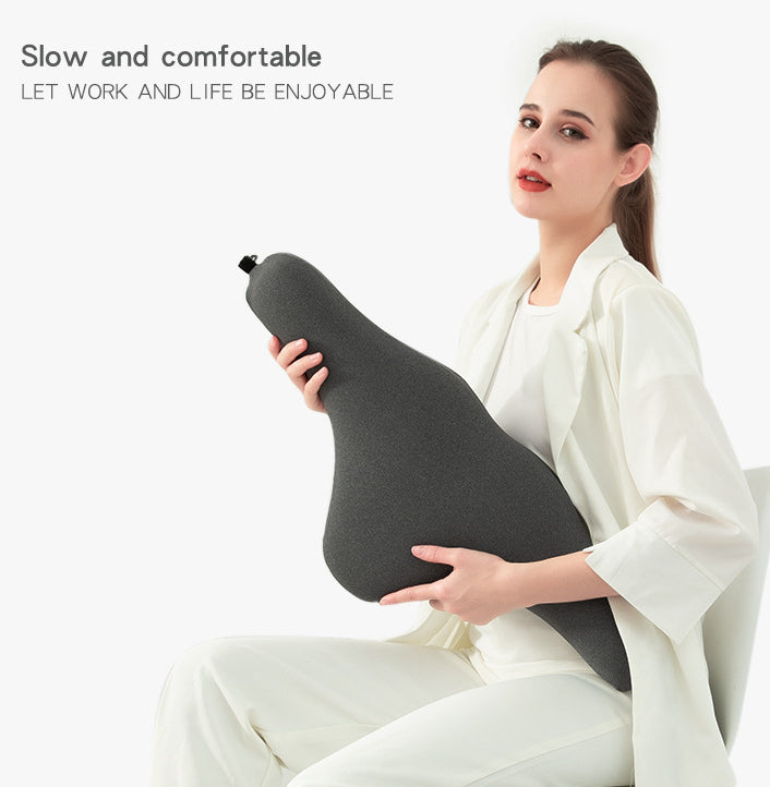Woman in white holding ergonomic dark gray pillow, modern gift from sps street style
